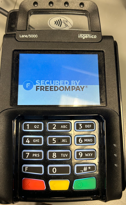 A close up of a credit card machine

Description automatically generated